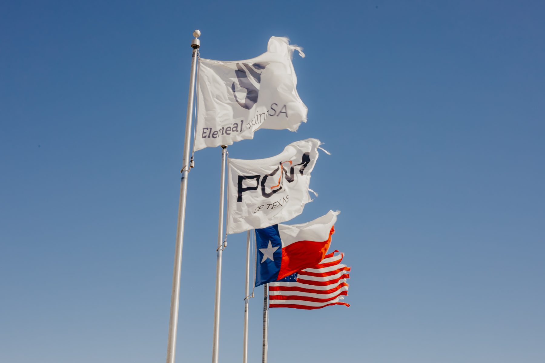 Flags at the San Marcos, TX headquarters